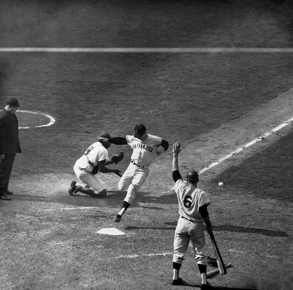 San Francisco's Ernie Bowman scores a game-tying run in the ninth inning of Game 3 of the 1962 NL tiebreaker series.