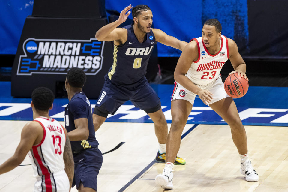 Ohio State's Zed Key (23) is pressured by Oral Roberts' Kevin Obanor (0) during the first half of a first round game in the NCAA men's college basketball tournament, Friday, March 19, 2021, at Mackey Arena in West Lafayette, Ind. (AP Photo/Robert Franklin)