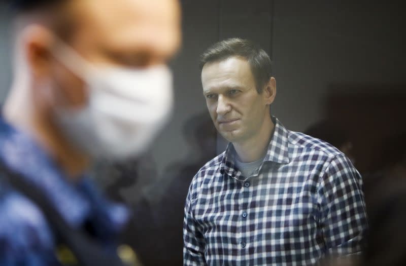 FILE PHOTO: Russian opposition politician Alexei Navalny attends a hearing hearing to consider an appeal against an earlier court decision to change his suspended sentence to a real prison term