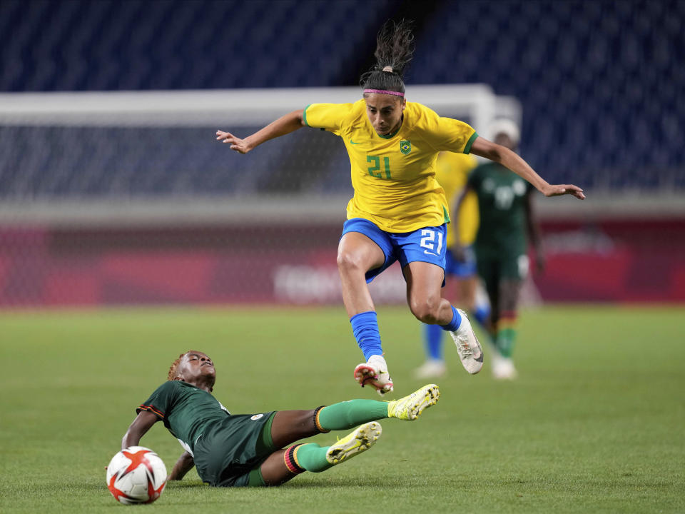 Zambia's Ireen Lungu, bottom, and Brazil's Andressa battle for the ball during a women's soccer match at the 2020 Summer Olympics, Tuesday, July 27, 2021, in Saitama, Japan. (AP Photo/Martin Mejia)