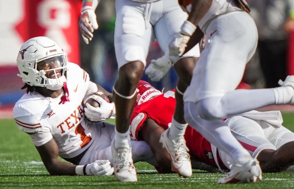 Texas wide receiver Xavier Worthy (1) smiles after running the ball for a return in the second quarter of the Longhorn's game against the Cougars at TDECU Stadium in Houston, Saturday, Oct. 21, 2023.