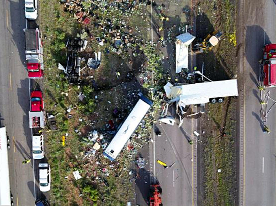 An aerial photo shows the chaotic crash site where eight people were killed and as many as 49 others injured. Source: New Mexico State Police via AP