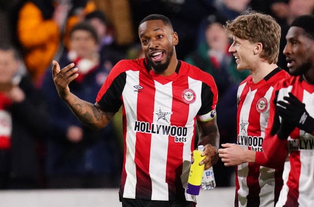 Toney celebrates with his man of the match award 