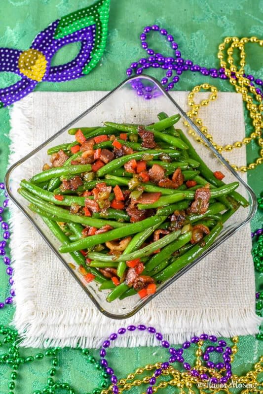 <p>Flavor Mosaic</p><p>Creole Green Beans are savory and spicy and delicious with bacon, onions, tomatoes, chilies, and cajun seasoning and make a perfect Cajun Side Dish for Mardi Gras or any time.</p><p><strong>Get the recipe: <a href="https://flavormosaic.com/creole-green-beans/" rel="nofollow noopener" target="_blank" data-ylk="slk:Creole Green Beans;elm:context_link;itc:0;sec:content-canvas" class="link rapid-noclick-resp">Creole Green Beans</a></strong></p>
