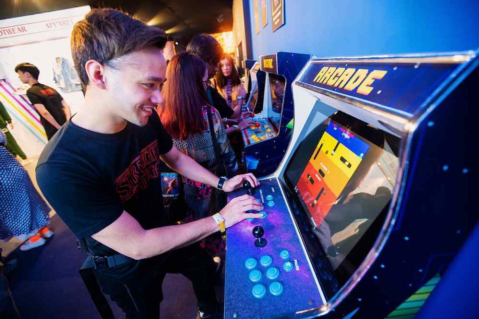 A player trying his hand at 'Dig Dug' at the Palace Arcade. — Picture courtesy of 'All Is Amazing' and Netflix