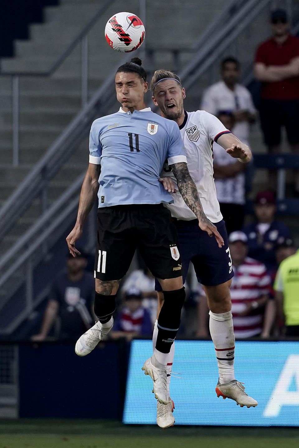 Uruguay forward Darwin Nunez (11) and USA defender Walker Zimmerman, right, battle for the ball during the second half of an international friendly soccer match Sunday, June 5, 2022, in Kansas City, Kan. The match ended in a 0-0 tie. (AP Photo/Charlie Riedel)