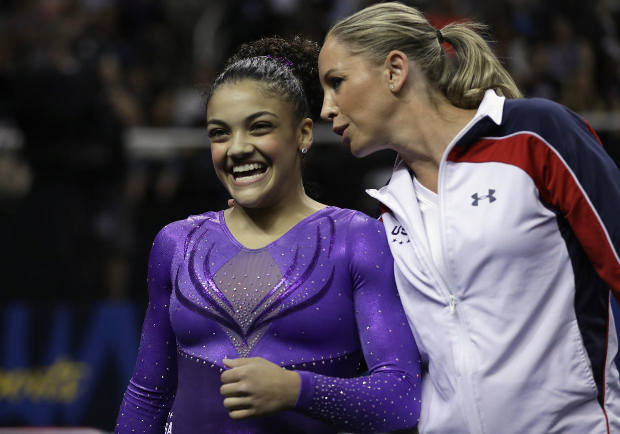 Lauren Hernandez with Maggie Haney after competing on the balance beam.