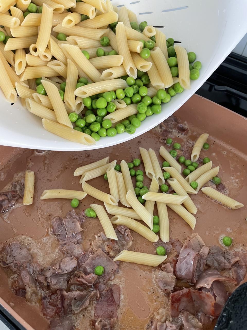 adding pasta to skillet