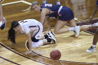 Gonzaga's Kaylynne Truong (14) loses the ball as Belmont's Conley Chinn (20) defends during the first half of a college basketball game in the first round of the women's NCAA tournament at the University Events Center in San Marcos, Texas, Monday, March 22, 2021. (AP Photo/Chuck Burton)