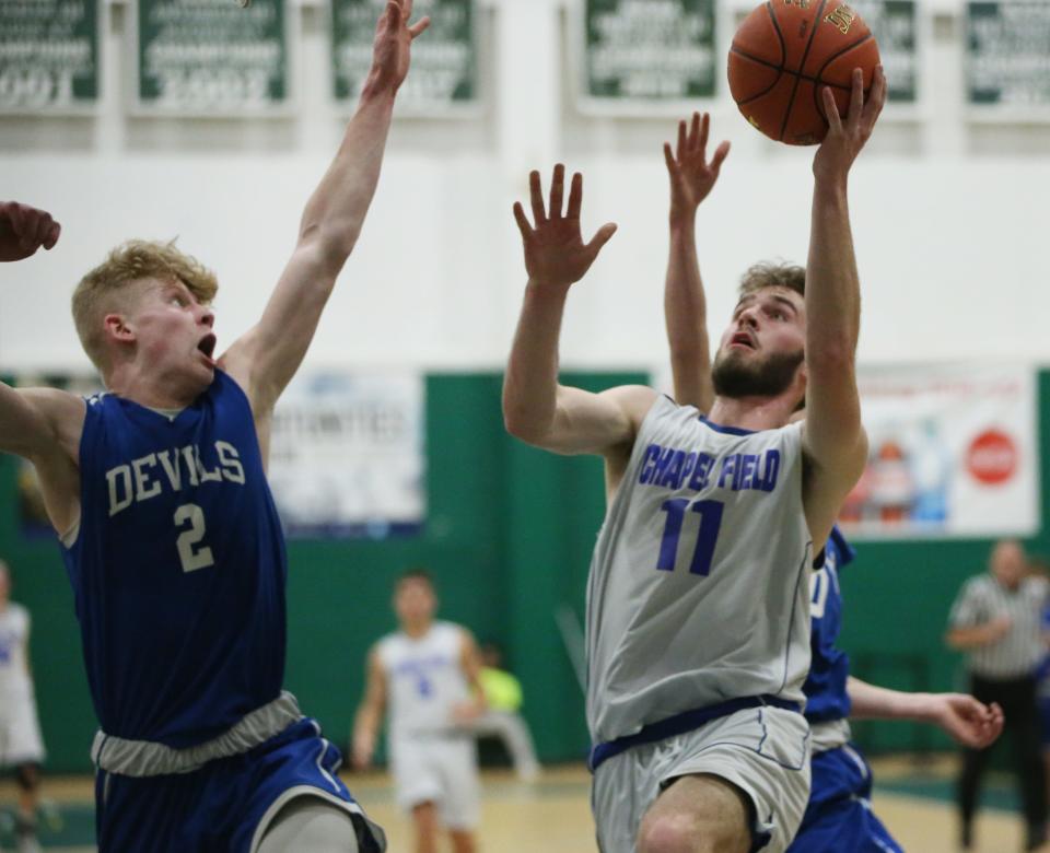 Chapel Field's Mickey Bonagura drives to the net against Roscoe's Aiden Johnston during the Section 9 Class D boys basketball final at SUNY Sullivan on March 1, 2023. 