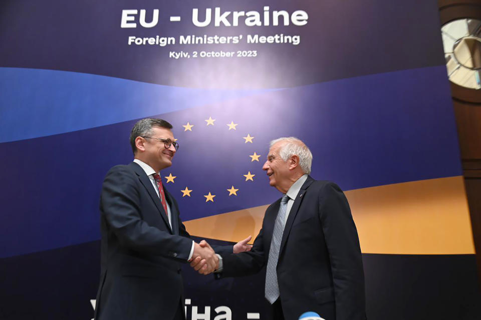 In this photo distributed by Dmytro Kuleba Twitter on Monday, Oct. 2, 2023, Ukrainian Foreign Minister Dmytro Kuleba, left, and EU High Representative for Foreign Affairs Josep Borrell shake hands at the opening of the informal EU Foreign Ministers meeting in Kyiv, Ukraine. Some of Europe's top diplomats have gathered in Kyiv in a display of support for Ukraine's fight against Russia's invasion as signs emerge of political strain in Europe and the United States about the war. (Dmytro Kuleba Twitter account via AP)