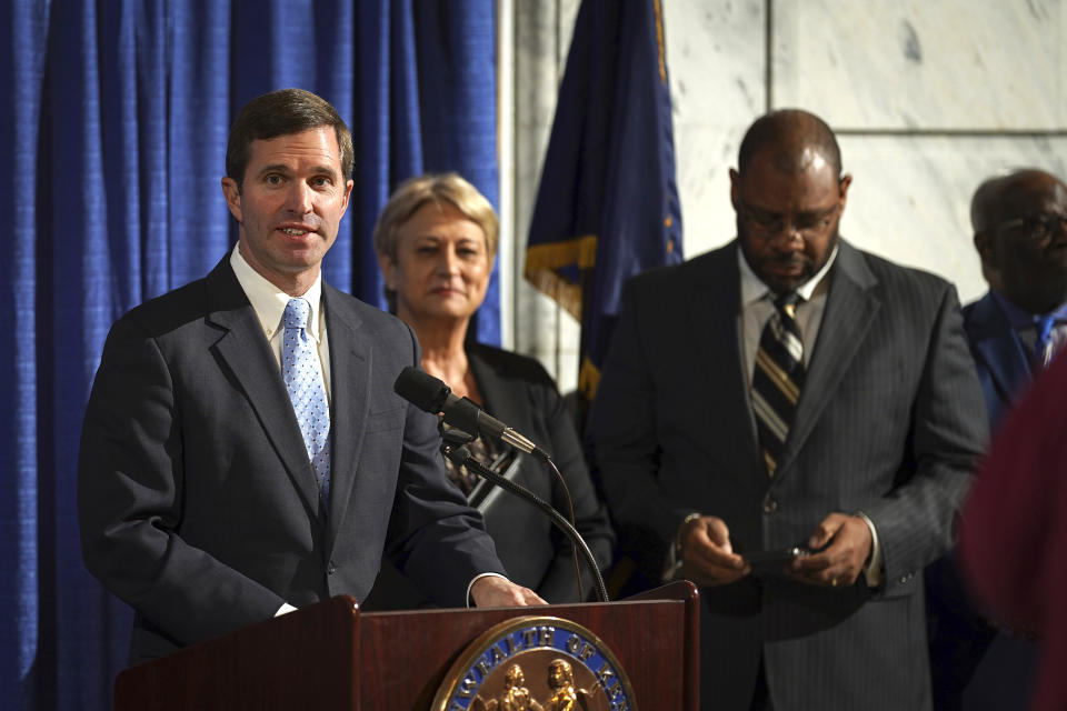 Kentucky Democratic Governor Andy Beshear speaks at a press conference before signing an executive order to reinstate the voting rights of over 100,000 non-violent felons who have completed their sentences, at the Capitol in Frankfort, Ky., Thursday, Dec. 12, 2019. (AP Photo/Bryan Woolston)