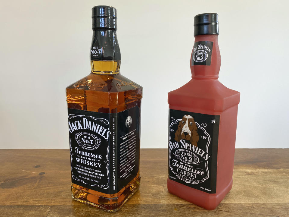 A bottle of Jack Daniel's Tennessee Whiskey is displayed next to a Bad Spaniels dog toy in Arlington, Va., Sunday, Nov. 20, 2022. Jack Daniel's has asked the Supreme Court justices to hear its case against the manufacturer of the toy. (AP Photo/Jessica Gresko)