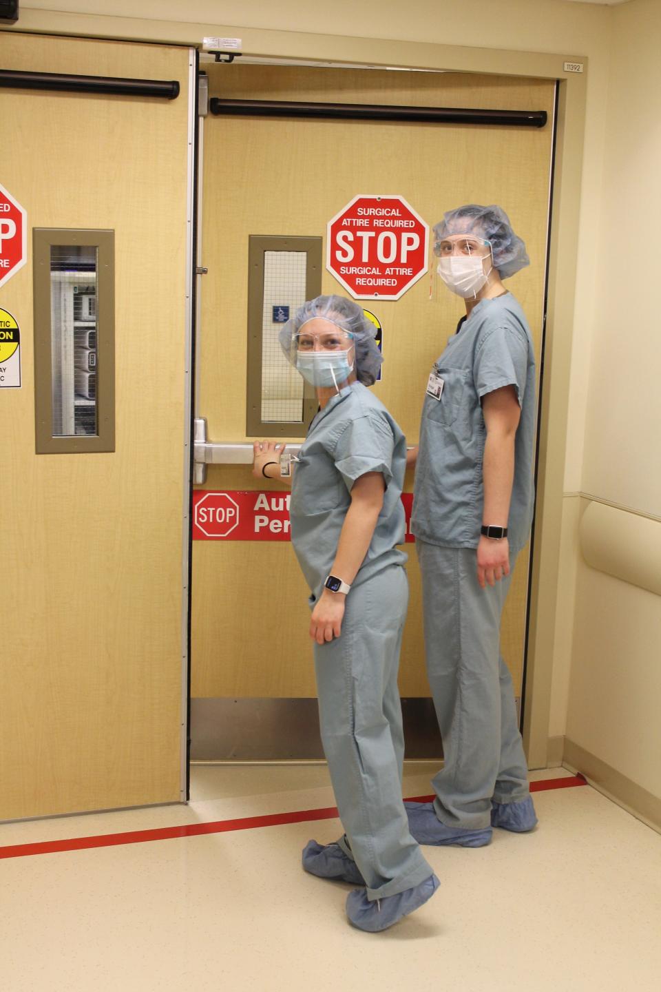 Alex Finocchario, left, and Bridget Miller enter the operating room at Thompson Hospital to observe a gynecological surgery performed by Dr. Jillian Babu. The two are among the high school seniors on Thompson’s campus through Wayne-Finger Lakes BOCES’ New Vision Programs.