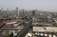 A street is seen deserted during weekend lockdown in Mumbai, India, Saturday, April 10, 2021. India has been overwhelmed by hundreds of thousands of new coronavirus cases daily, bringing pain, fear and agony to many lives as lockdowns have been placed in Delhi and other cities around the country. (AP Photo/Rajanish Kakade)