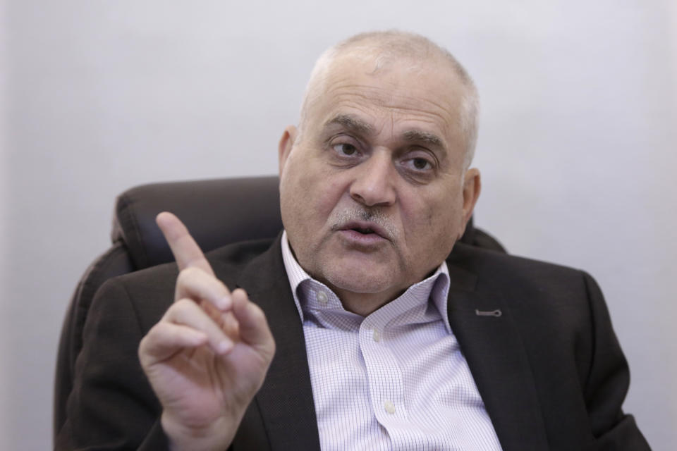 Lebanese Health Minister Jamil Jabak speaks during an interview at his private clinic in a southern suburb of Beirut, Lebanon, Saturday, May 18, 2019. Jabak says he has "overcome" U.S. concerns over the possibility of his ministry's finances going to the Hezbollah militant group, by gaining public trust and ensuring transparency. (AP Photo/Hassan Ammar)