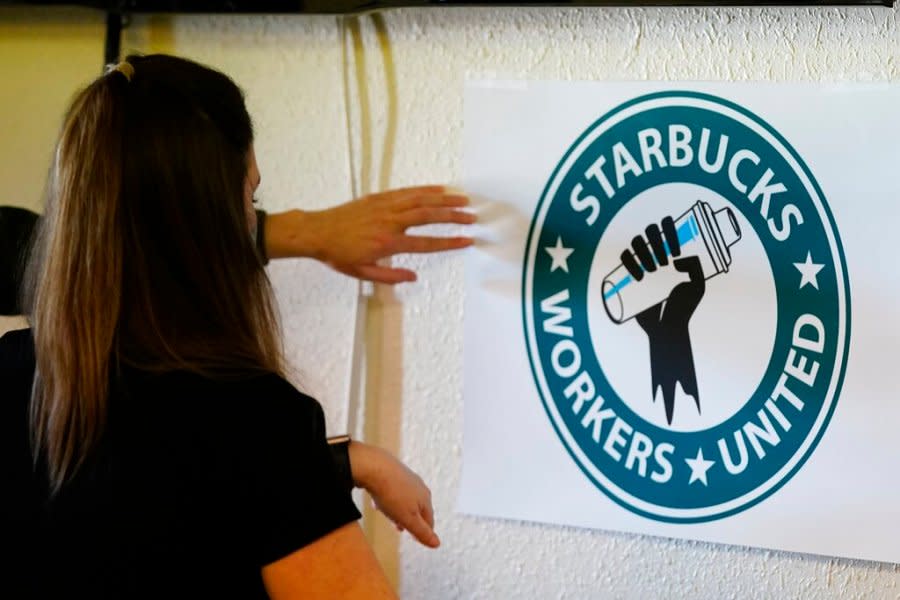 <sub>Michelle Eisen, a barista at the Buffalo, N.Y., Elmwood Starbucks location, helps out the local Starbucks Workers United, employees of a local Starbucks, as they gather at a local union hall to cast votes to unionize or not, Feb. 16, 2022, in Mesa, Ariz. (AP Photo/Ross D. Franklin)</sub>