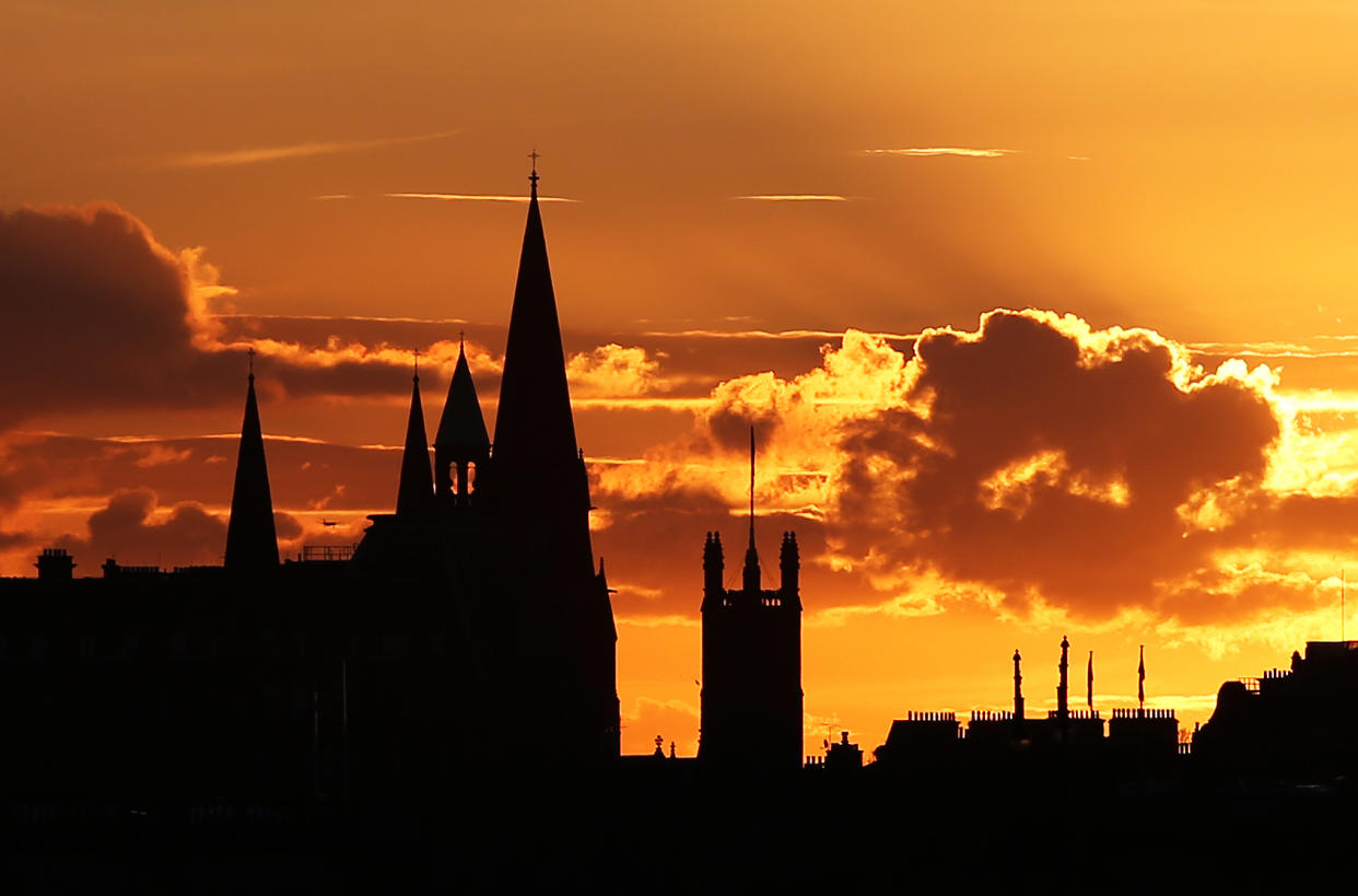 The sun sets over the Edinburgh skyline. (Photo by Jane Barlow/PA Images via Getty Images)