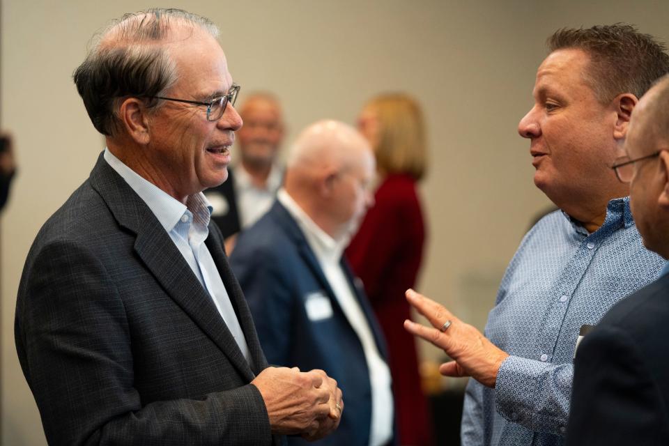 Sen. Mike Braun, left, talks with attendees of the National Federation of Independent Businesses gubernatorial candidate forum and luncheon on Tuesday, March 19, 2024, at the Wellington Fishers Banquet & Conference Center in Fishers, Indiana.