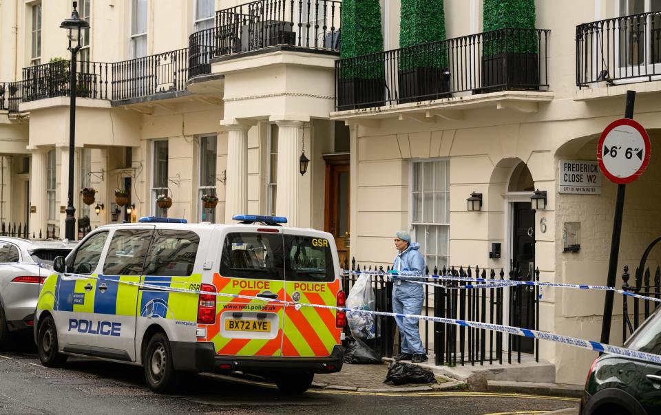 A member of the forensic search team outside the property near Hyde Park