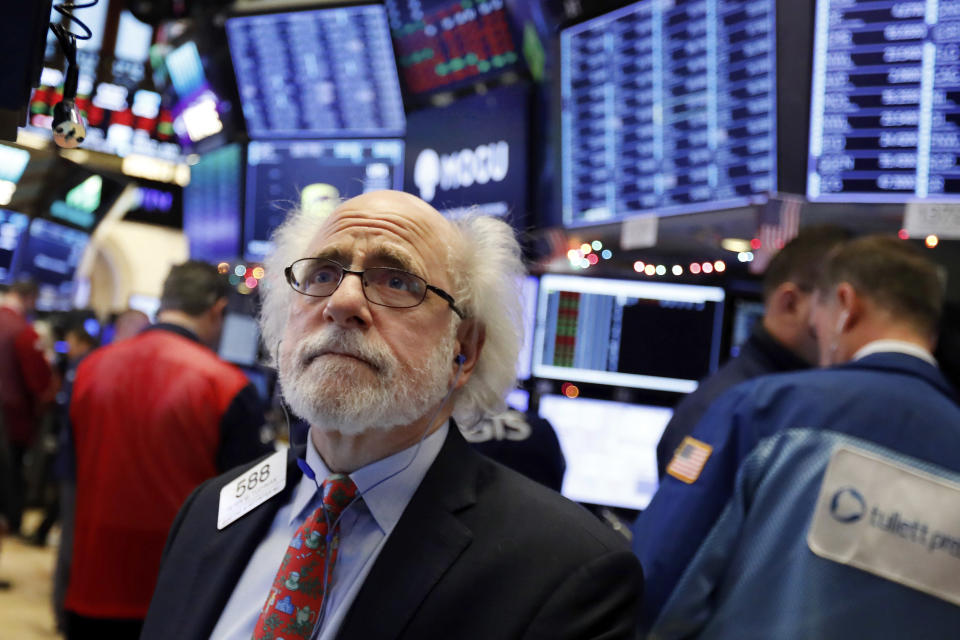 Trader Peter Tuchman works on the floor of the New York Stock Exchange, Thursday, Dec. 6, 2018. U.S. stocks tumbled in early trading Thursday following a sell-off in overseas markets. (AP Photo/Richard Drew)