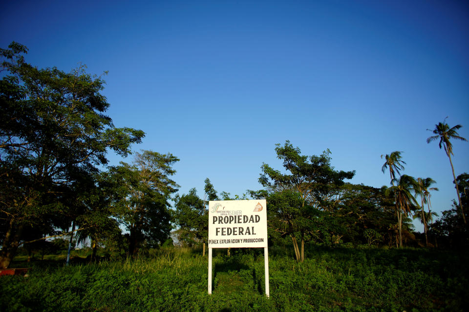 A sign stands in an area belonging to the state-run oil company Pemex, in which a new oil refinery is planned, Paraíso, Mexico