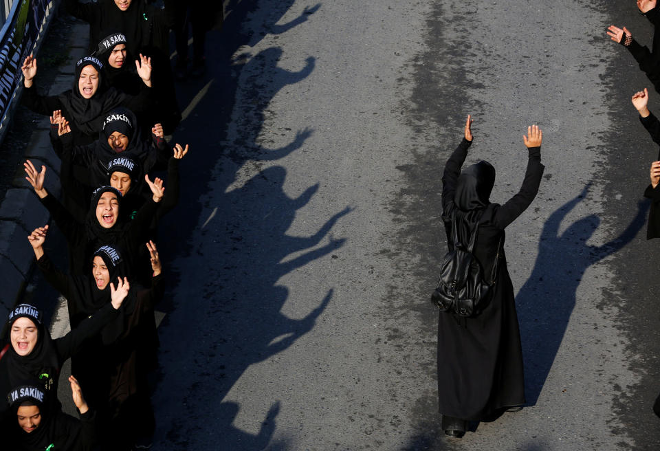 The holy day of Ashura around the worldIslamic slogans as they mourn during an Ashura procession in Istanbul
