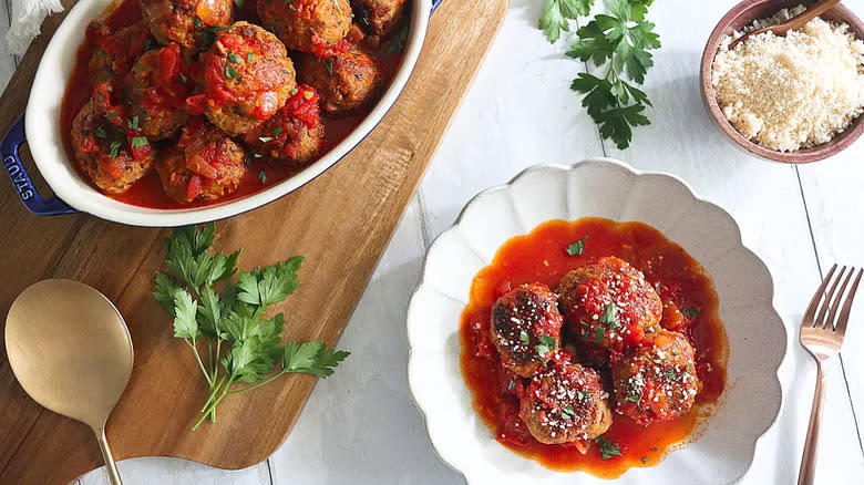 Meatballs in dish and plate with Parmesan