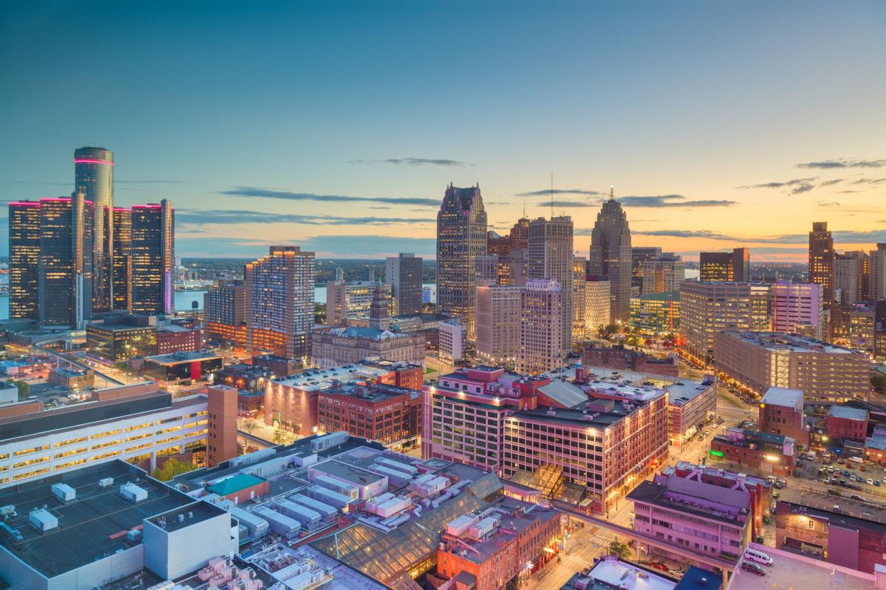 Detroit, Michigan, USA downtown skyline from above at dusk.