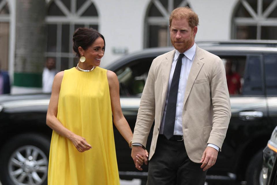 <p>KOLA SULAIMON/AFP via Getty</p> Meghan Markle and Prince Harry arrive at the State Governor House in Lagos on May 12, 2024 as they visit Nigeria as part of celebrations of Invictus Games anniversary. 