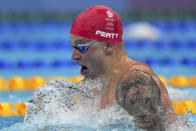 Adam Peaty of Britain swims in the mixed 4x100-meter medley relay heats at the 2020 Summer Olympics, Thursday, July 29, 2021, in Tokyo, Japan. (AP Photo/Matthias Schrader)