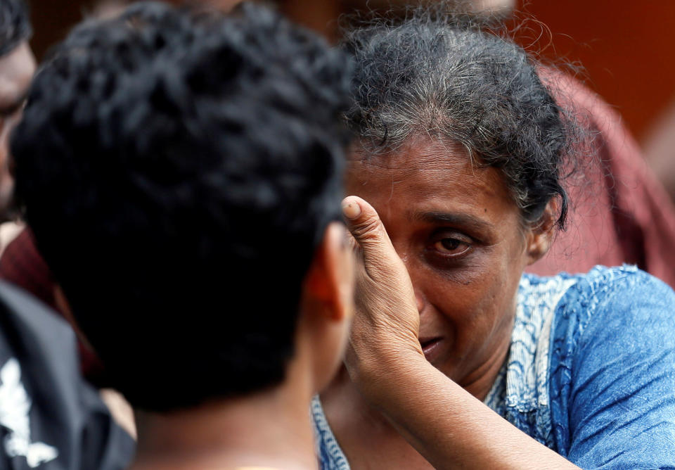 <p>A relative of a victim reacts at a landslide site during a rescue mission in Athwelthota village, in Kalutara, Sri Lanka, May 28, 2017. (Dinuka Liyanawatte/Reuters) </p>