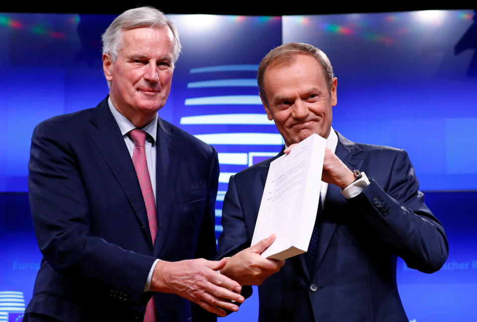 EU chief negotiator Michel Barnier and European Council president with the 585 page Withdrawal Agreement (Reuters)