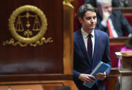 French Prime Minister Gabriel Attal walks to the podium for his speech to the lawmakers at the National Assembly in Paris, Tuesday, Jan. 30, 2024. French Prime Minister Gabriel Attal said on Tuesday his top priority is to boost employment in his general policy address to lawmakers, three weeks after he was appointed. Attal is facing his first major challenge as angry farmers are protesting across the country and around Paris against low wages and other problems. (AP Photo/Michel Euler)