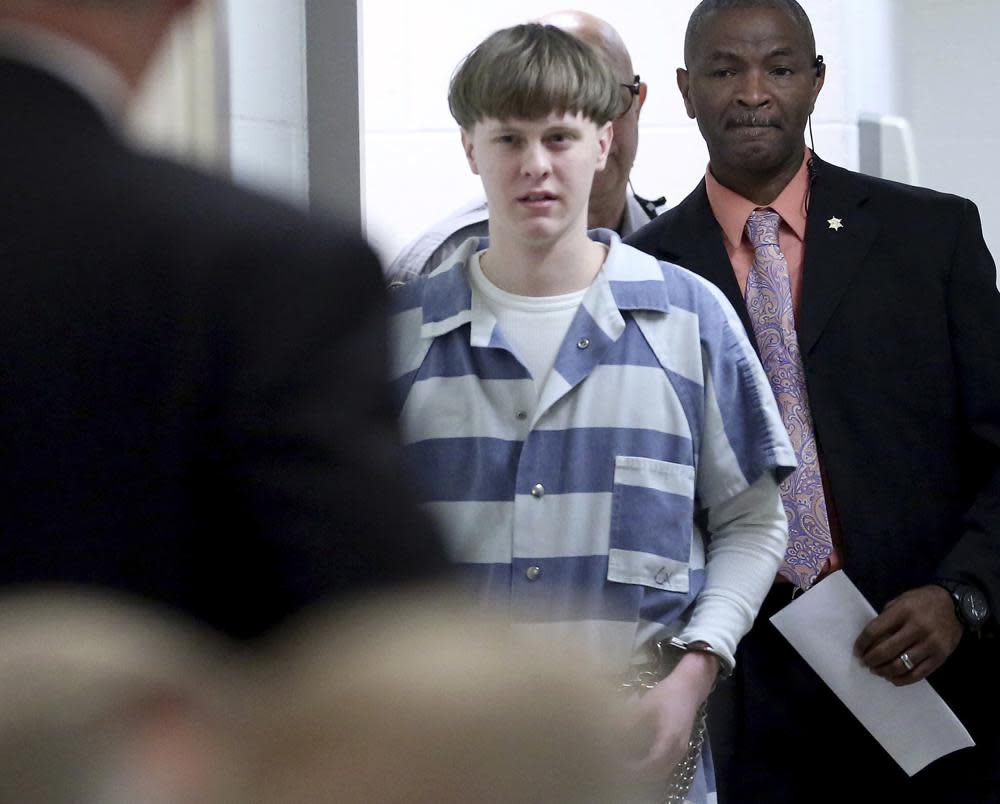 Dylann Roof enters the court room at the Charleston County Judicial Center to enter his guilty plea on murder charges on April 10, 2017, in Charleston, S.C. (Grace Beahm/The Post And Courier via AP, Pool, File)