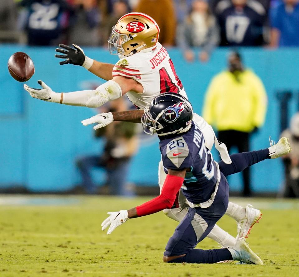 Tennessee Titans cornerback Kristian Fulton (26) breaks up a pass intended for San Francisco 49ers fullback Kyle Juszczyk (44) during the fourth quarter at Nissan Stadium Thursday, Dec. 23, 2021 in Nashville, Tenn. 