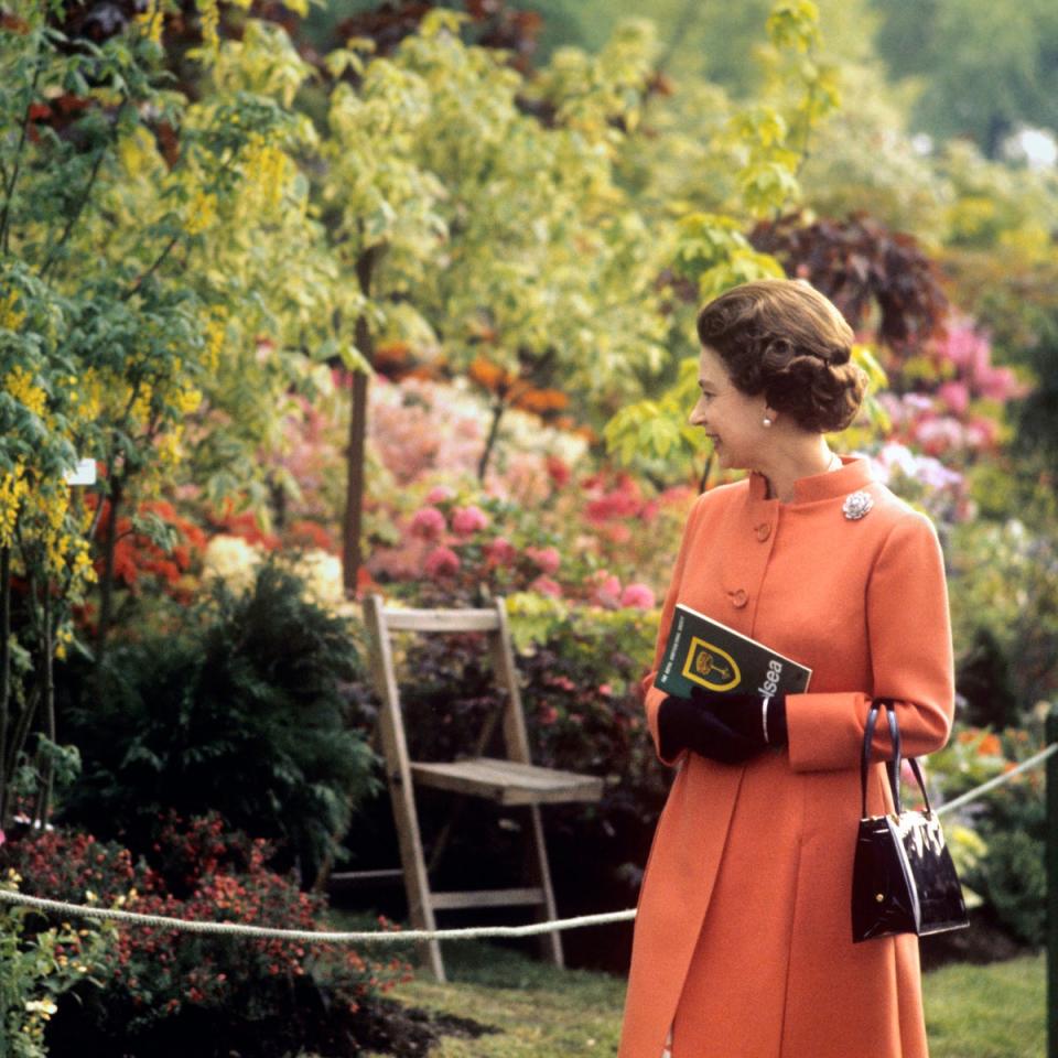 Queen Elizabeth II during her visit to the Chelsea Flower Show in London, a regular fixture in the royal calendar, 1971 (PA)