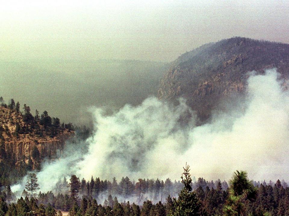 Wildfires fueled by high winds and dry conditions burn out of control in Los Alamos, New Mexico on May 11, 2000.