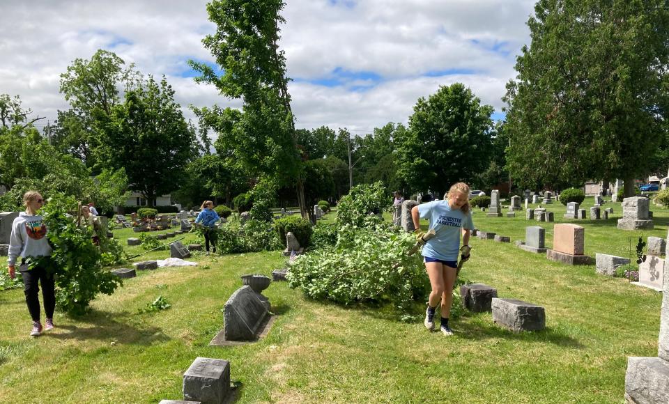 Girl Scouts from Geneseo, Boy Scouts and other volunteers helped to clean up Temple Hill Cemetery in Geneseo, Livingston County, after a wind storm toppled trees on June 16, 2022.