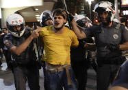 <p>A demonstrator is detained by the police during a rally in support of Brazil’s suspended President Dilma Rousseff and against acting President Michel Temer in São Paulo, Aug. 29, 2016. (Photo: AP/Andre Penner) </p>