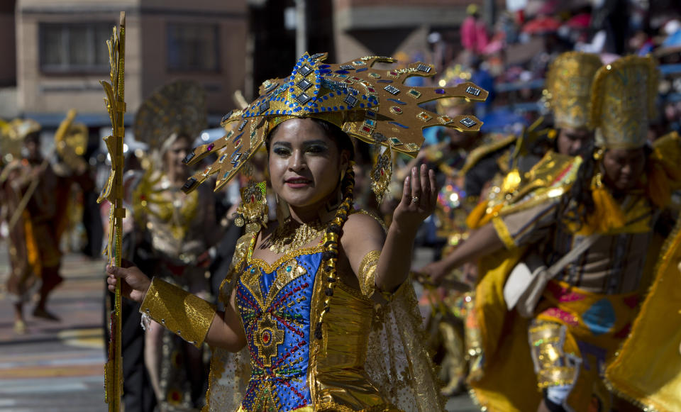 Women perform in the traditional "Inca" dance during Carnival, in Oruro, Bolivia, Saturday, March 2, 2019. The unique festival features spectacular folk dances, extravagant costumes, beautiful crafts, lively music, and up to 20 hours of continuous partying with lots of tourists, drawing crowds of up people annually. (AP Photo/Juan Karita)