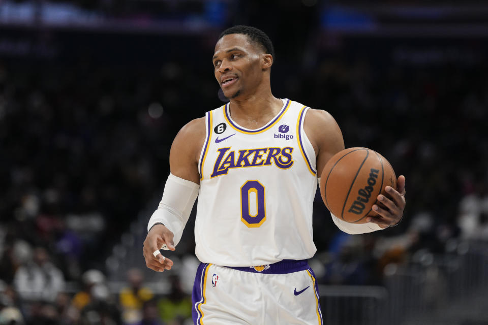 Los Angeles Lakers guard Russell Westbrook (0) dribbles against the Washington Wizards during the first half of an NBA basketball game, Sunday, Dec. 4, 2022, in Washington. (AP Photo/Jess Rapfogel)