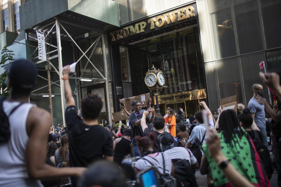 Protesters march in front of Trump Tower during a solidarity rally for George Floyd, Saturday, May 30, 2020, in New York. Demonstrators took to the streets of New York City to protest the death of Floyd, a black man who was killed in police custody in Minneapolis on May 25. (AP Photo/Wong Maye-E)