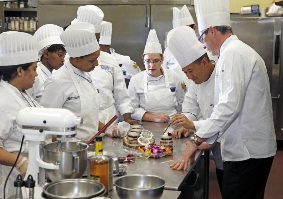 Michael Angnardo, Department Chair of the College of Culinary Arts, second from right, teaches at Johnson & Wales University on Jan. 7.