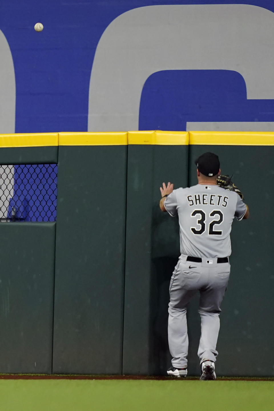 Chicago White Sox right fielder Gavin Sheets (32) can't reach the solo home run hit by Texas Rangers' Ezequiel Duran during the third inning of a baseball game in Arlington, Texas, Saturday, Aug. 6, 2022. (AP Photo/LM Otero)