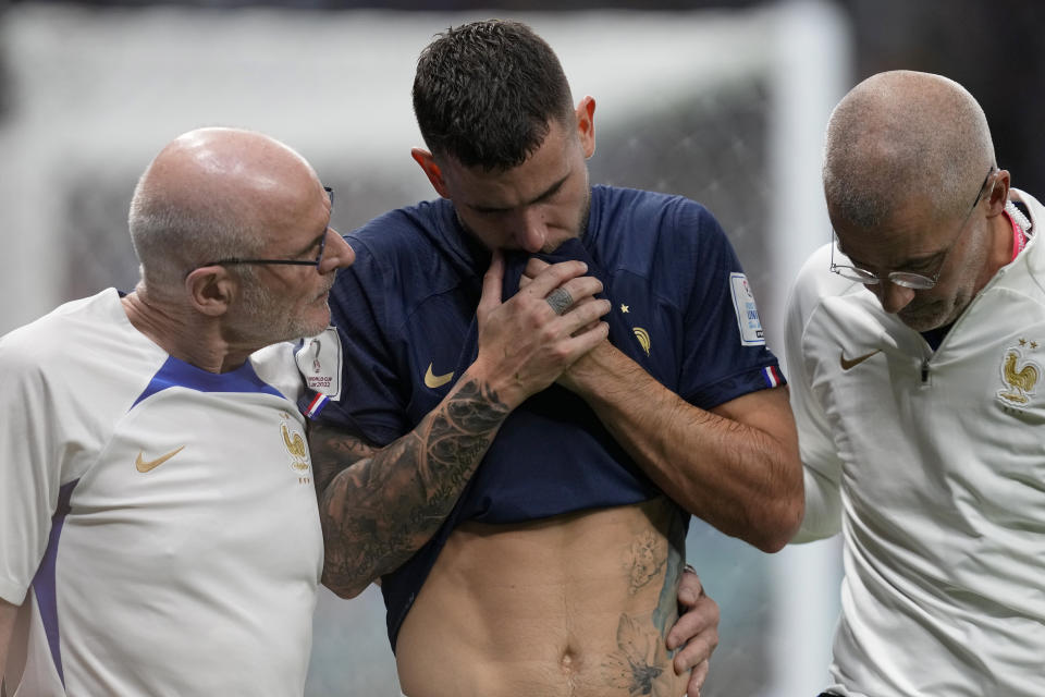 France's Lucas Hernandez leaves the pitch after getting injured during the World Cup group D soccer match between France and Australia, at the Al Janoub Stadium in Al Wakrah, Qatar, Tuesday, Nov. 22, 2022. (AP Photo/Thanassis Stavrakis)