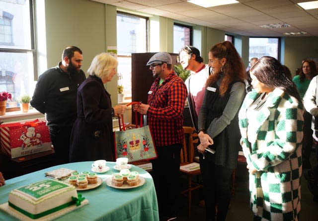 Queen Camilla gives gifts to companions during his visit 