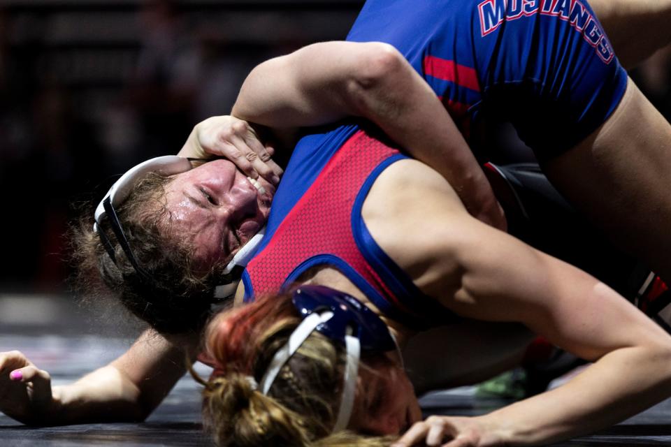 Uintah’s Chanley Green and Crimson Cliffs’ Quinci Smith compete in the 4A Girls Wrestling State Championships at the UCCU Center in Orem on Thursday, Feb. 15, 2024. | Marielle Scott, Deseret News