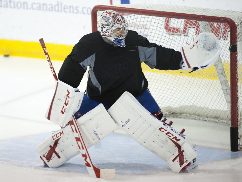Montreal Canadiens goaltender Carey Price makes a save during an informal training session at the team's training facility in Brossard, Quebec, Monday, Sept. 17, 2012, on day two of the NHL hockey lockout. (AP Photo/The Canadian Press, Graham Hughes)
