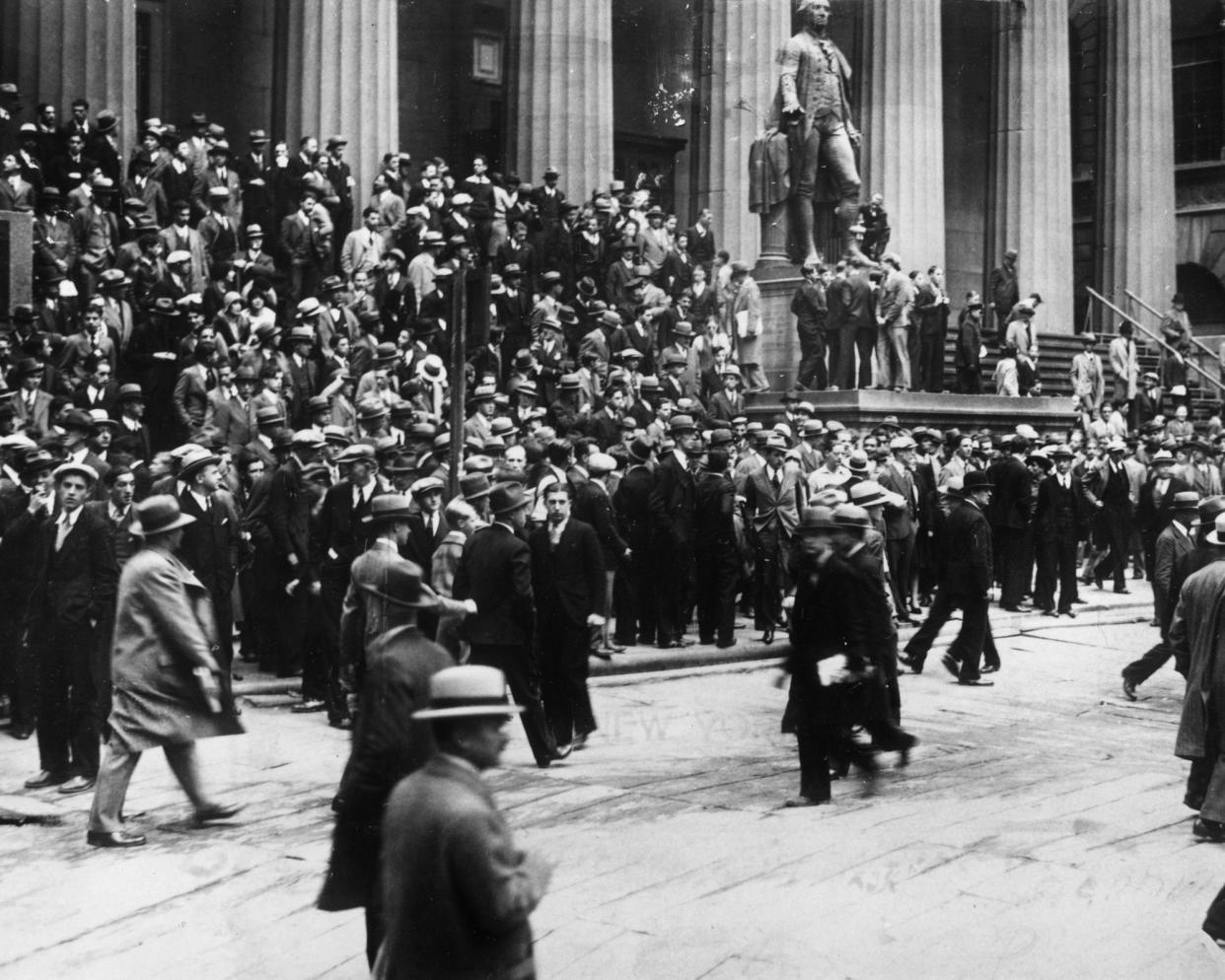 24th october 1929: huge crowds outside the sub treasury building watching the wall street stock exchange across the corner